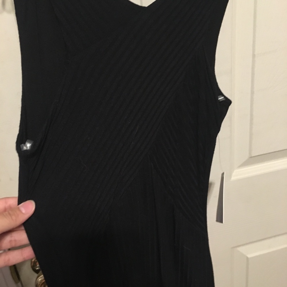 Black tight dress with crossover detailing infront